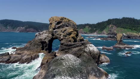 An-orbiting-drone-shot,-rotating-around-an-isolated-sea-mount,-off-the-Oregon-coast-in-the-Pacific-Northwest