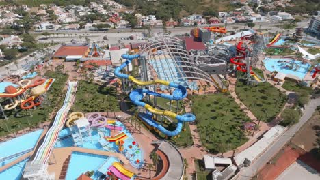 Aerial-orbit-above-empty-water-park-slides-and-pools-in-Algarve-Portugal