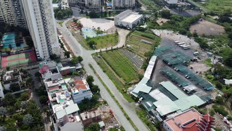 Drone-bird's-eye-view-above-open-courtyard-and-road-scene-in-Ho-Chi-Minh-City