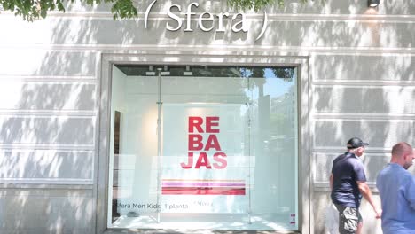 Pedestrians-walk-past-the-Spanish-clothing-manufacturing-and-brand-Sfera-store-in-Spain