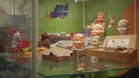 a-unique-exhibition-within-National-Technical-Museum,-showcasing-an-array-of-doll-heads-in-Prague,-Czech-Republic