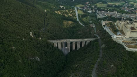 Aerial-View-Of-Ponte-Delle-Torri-Striking-Arched-Bridge-In-Spoleto-Next-To-Rocca-Albornoziana-Fortress