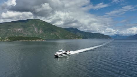 High-speed-express-catamaran-boat-named-Vingtor-is-cruising-to-Balestrand-at-the-Sognefjord-in-Norway---Aerial