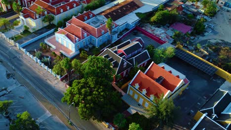 Aerial-oblique-angled-bird's-eye-view-along-famous-iconic-home-street-in-willemstad-curacao