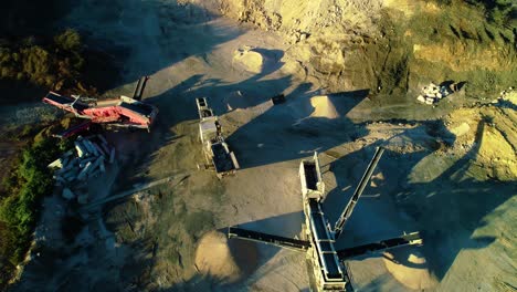 High-angle-view-of-separator-tracks-and-heavy-machinery-creating-piles-of-dirt-and-soil-fill