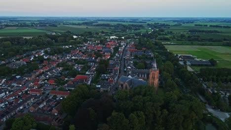 Aerial-view-of-a-historical-town-center-of-beautiful-Dutch-village-at-sunset