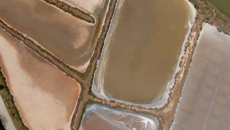 Top-view-of-salt-pans-drying-beds-near-river-in-Portimao-Algarve-Portugal
