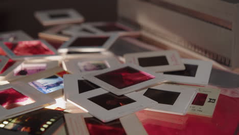 Slow-camera-movement-over-a-pile-of-colour-slides