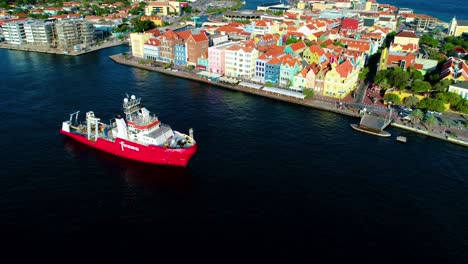 High-angle-aerial-view-of-safety-survey-research-coastguard-vessel-exiting-willemstad-curacao
