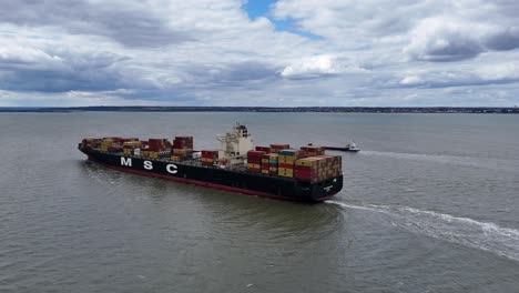 Drone-tracking-MSC-Madeleine-container-ship-sailing-up-river-Thames-Estuary-Aerial