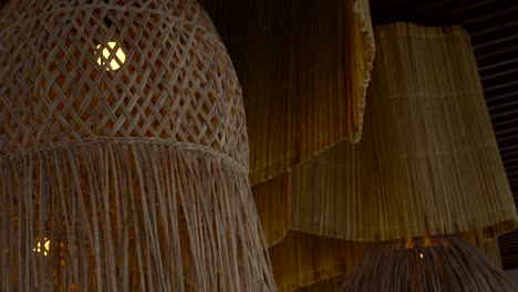 Beach-restaurant-lamps-handmade-of-palm-leaf-embroidery-handicraft-bayside-bayfront-evening-chill-lounge-slow-motion-sunset