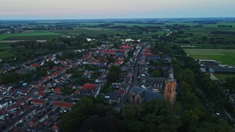 Beautiful-aerial-of-a-historical-town-in-the-Netherlands-at-sunset-in-summer