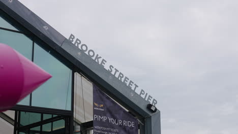 Brooke-Street-Pier-Sign-In-Hobart,-Tasmania-Famous-Port,-4K-Slow-Motion