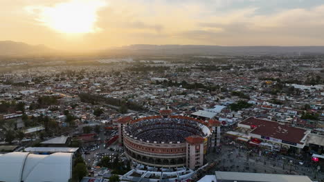 Plaza-de-Toros-Monumental-de-Aguascalientes,-golden-hour-in-Mexico---aerial-view