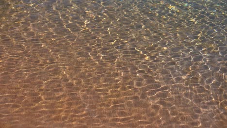 Soft-wave-of-the-sea,-beach-sand-texture