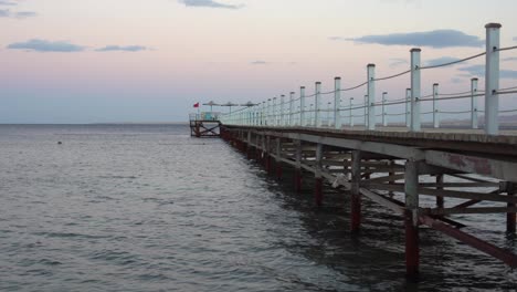 Golden-sea-sunset-on-the-wooden-pier.