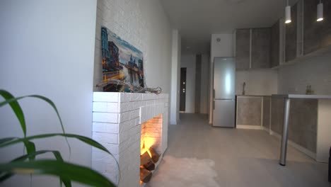 Modern-minimalistic-dark-gray-loft-style-studio-apartment-interior-design.-kitchen,-sitting-area,-workplace