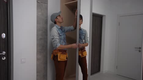 handyman-installing-wardrobe,-assemble-the-cabinet-furniture-for-clothes