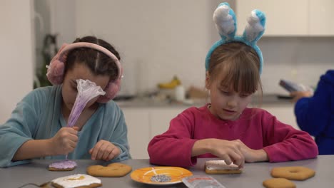 two-little-girls-making-gingerbread-cookies-at-home.