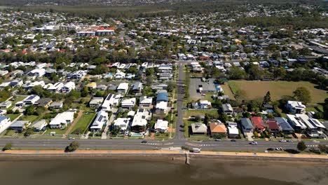 Aerial-view-moving-left-to-right,-of-Sandgate-and-Brighton-waterfront-on-a-sunny-day,-Brisbane,-Queensland,-Australia