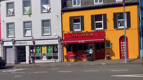 A-4k-look-he-quaint-Main-Street-of-Kenmare-and-their-vivid-painted-shops-Co-Kerry-Ireland