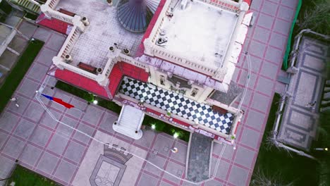 Aerial-view-of-the-roof-of-the-Falabella-Palace,-black-and-white-marble-tiles-with-round-decorative-window-Consistorial-House-of-Providencia