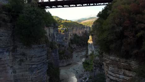 Drone-flight-in-the-Osumi-Canyon-in-Albania-under-a-bridge