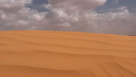 Clouds-over-Sahara-desert-dune.-Handheld-footage