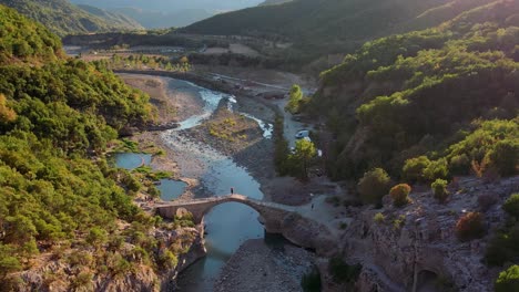 Aerial-of-sunset-of-bridge-over-river-in-Langarica-Canyon-in-Albania