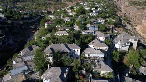 Aerial-of-old-houses-in-Gjirokaster,-ancient-city-in-Albania,-Europe