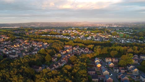 Establishing-Aerial-Shot-of-Solar-Powered-Suburban-Houses-at-Sunrise-in-UK