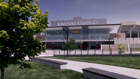Jack-Trice-Stadium-on-the-campus-of-Iowa-State-University-in-Ames,-Iowa-with-stable-video-wide-shot-with-tree
