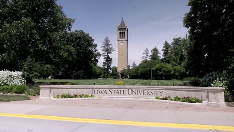 Stanton-Memorial-Carillon-Campanile-on-the-campus-of-Iowa-State-University-in-Ames,-Iowa-with-gimbal-video-walking-forward-wide-shot