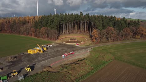 Wind-Turbine-Foundation-Constructed-Amidst-Pine-Forest-And-Rural-Fields-In-Germany