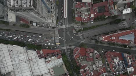 Multi-lane-city-intersection-with-vehicle-traffic-driving,-Mexico-City