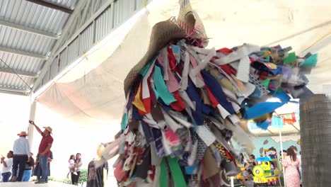 Slow-motion-shot-of-a-man-wearing-hundreds-of-strands-of-fabric-at-the-Guelaguetza-event