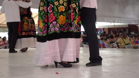 Slow-motion-shot-of-couples-dancing-traditional-dances-on-the-stage-at-the-guelaguetza
