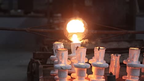 slow-motion-scene-of-castings-heated-at-high-degrees-Celsius-being-carefully-filled-into-moulds