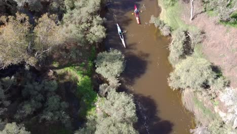 Aerial-Tilt-Down-View-Of-Two-Kayak-Competitors-In-The-Avon-Descent-Boat-Race-2023,-Perth-Australia