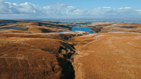 Aerial-drone,-cinematic-footage-of-a-valley-with-3-lakes-reservoirs,-piethorn,-kittcliffe-and-ogden-reservoir,-Oldham,-UK