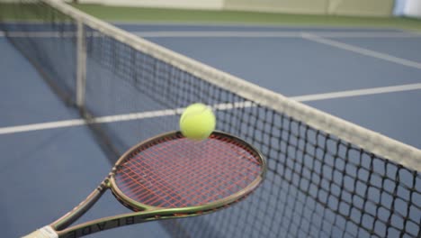 Tennis-Ball-Stops-On-The-Racket