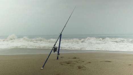 A-fishing-rod-standing-on-a-sand-spike-used-to-Surf-Fishing