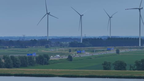 Aerial-View-Of-Spinning-Giant-Wind-Turbines-At-Moerdijk-In-The-Evening