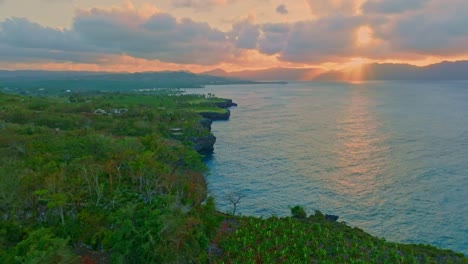 Drone-view-of-El-Cabito-Restaurant-area-on-the-edge-of-the-Sea-cliff,-Las-Galeras,-Samana,-Dominican-Republic