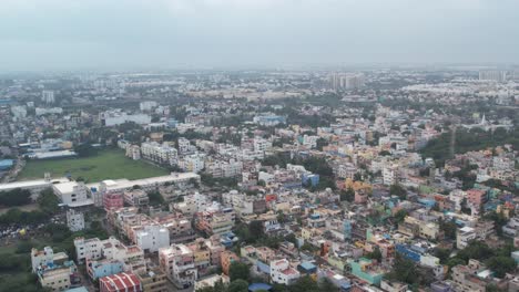 Residential-homes,-apartments,-vacant-lands,-and-parks-can-be-seen-in-an-aerial-video-of-an-South-Indian-city