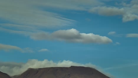 Reveal-shot-of-Mount-Tongariro-volcano-in-New-Zealand-during-daytime,-aerial