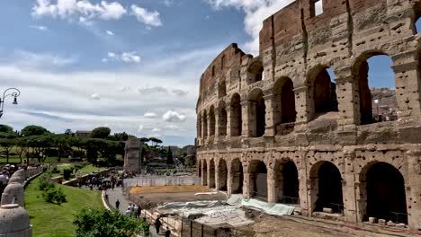 Exterior-Walls-Of-The-Colosseum,-the-famous-sightseeing-landmark-under-reconstruction-and-Renovation-during-a-restoration-project,-Rome,-Italy