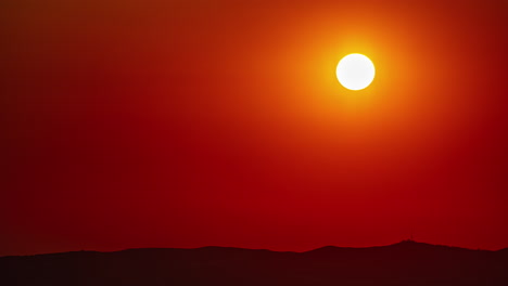 Descending-sun-during-sunset,-closeup-timelapse
