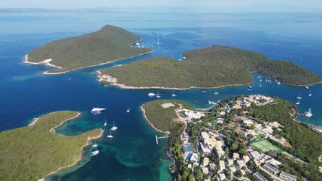 Syvota-Islands,-Coastal-Village-and-Boats-in-Ionian-Sea,-Epirus,-Greece-Mainland---Aerial