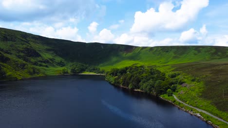 Aerial-Orbiting-Shot-of-a-Remote-Mountain-Lake-in-the-Mountains-in-Ireland